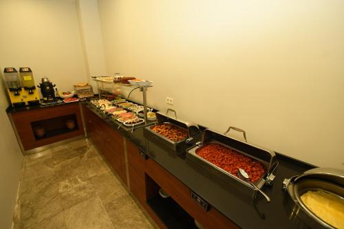 a buffet line with many different types of food at Novus Hotel İstanbul in Istanbul