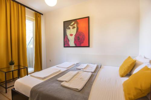 Cama o camas de una habitación en 4 Rooms Apartments