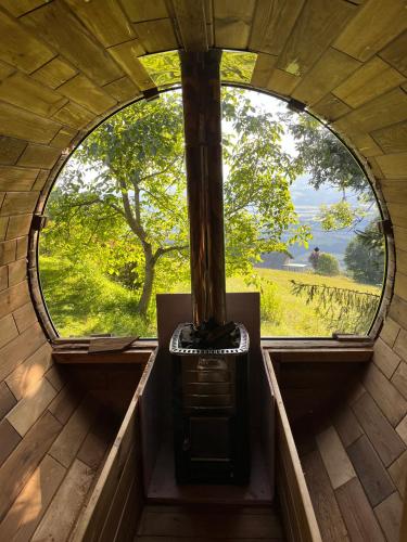 an inside view of a circular window in a building at Boutique Chalet - Herke in Eitweg