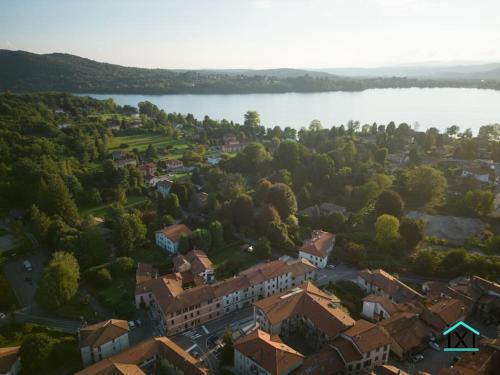 an aerial view of a town next to a lake at Travedona Loft by lake Ixihome in Travedona