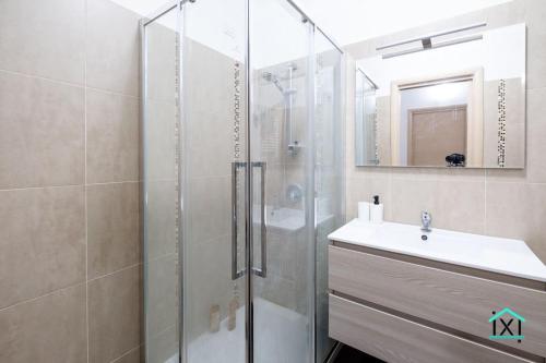 a bathroom with a shower and a sink and a mirror at Travedona Loft by lake Ixihome in Travedona