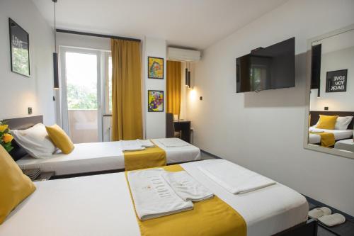 Cama o camas de una habitación en 4 Rooms Apartments
