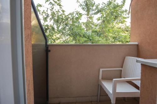 Un balcón o terraza de 4 Rooms Apartments