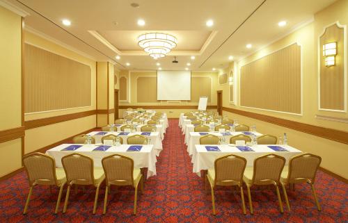 a room with rows of tables and chairs in it at Ankara Plaza Hotel in Ankara