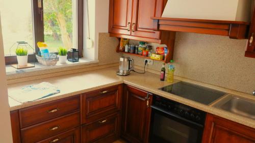 a kitchen with a sink and a counter top at AirSpot Balice in Cholerzyn