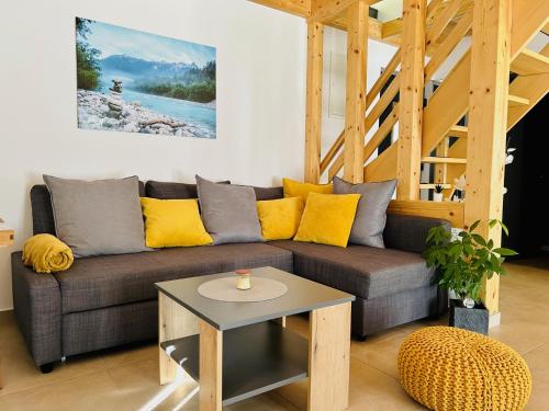 a living room with a couch and a table at HOLIDAY HOUSE - River Bača in Most na Soči
