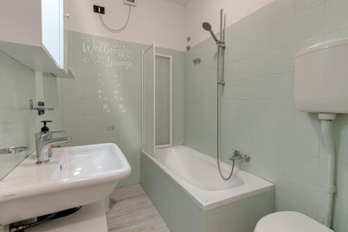 a bathroom with a sink and a shower and a toilet at Casa Boss Pisa Cisanello in Pisa