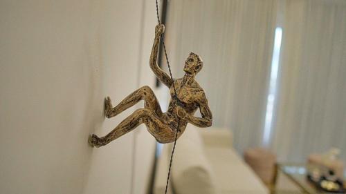 a metal statuette of a person doing a trick at Premium space in Santiago- 5 Min Away from airport in Santiago de los Caballeros