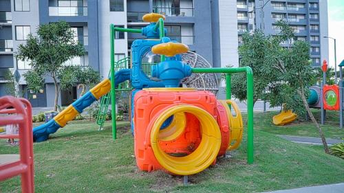 a playground with a slide in a park at Premium space in Santiago- 5 Min Away from airport in Santiago de los Caballeros