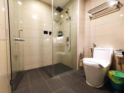 a bathroom with a shower stall and a toilet at TopGenting SkySunColdSuite5Pax at GrdIonDelmn in Genting Highlands