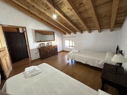 Postel nebo postele na pokoji v ubytování Casa Rural La Quinta Del Poeta