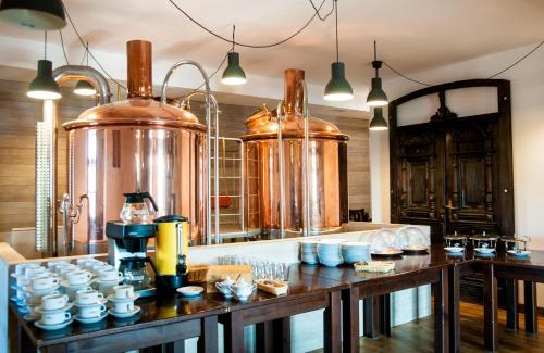 a kitchen with a bunch of pots and cups at Przystanek Tleń in Tleń