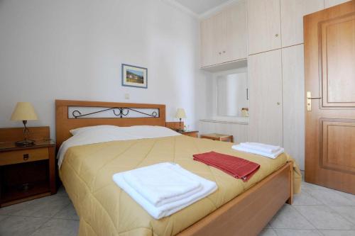 Säng eller sängar i ett rum på Tinos View Apartments