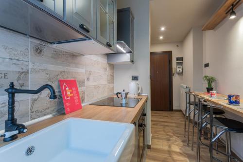 a kitchen with a sink and a counter top at Casa Thermignon by Wonderful Italy in Turin
