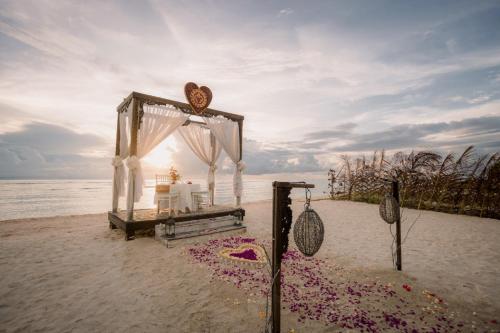 a wedding altar on the beach in the sand at Ombak Sunset in Gili Trawangan