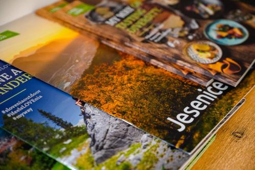 a magazine sitting on top of a table at Apartments Luxury AD in Jesenice