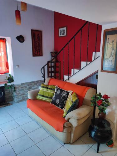 a living room with a couch and a staircase at My House - Casa Charme in Monchique