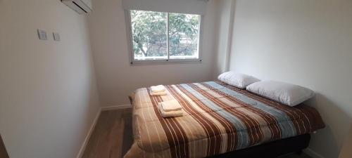 Ένα ή περισσότερα κρεβάτια σε δωμάτιο στο Roca Apartment