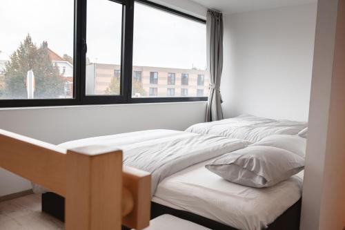 Una cama o camas en una habitación de K&Y suites 2 Brussels airport 500m!