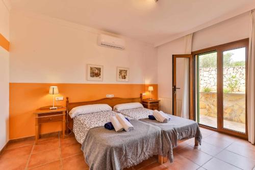 Katil atau katil-katil dalam bilik di Finca Puig des Call "cycling friendly"