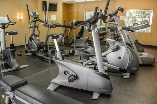 a gym with several exercise bikes in a room at Quality Suites Downtown San Luis Obispo in San Luis Obispo
