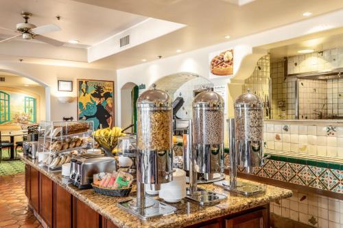 a kitchen with a counter with some food at Quality Suites Downtown San Luis Obispo in San Luis Obispo