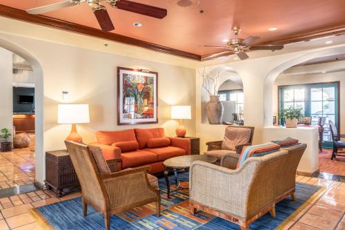 a living room with a couch and chairs at Quality Suites Downtown San Luis Obispo in San Luis Obispo
