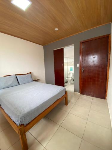 Ένα ή περισσότερα κρεβάτια σε δωμάτιο στο La Casa Hostel