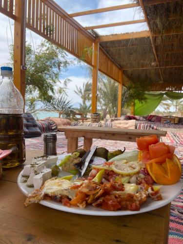 a plate of food on top of a table at Big Dune camp in Nuweiba