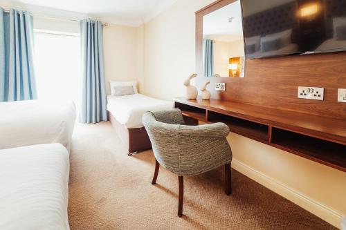 TV a/nebo společenská místnost v ubytování The Wyatt Hotel