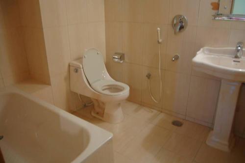 a bathroom with a toilet and a sink at Hotel Beach Way in Cox's Bazar