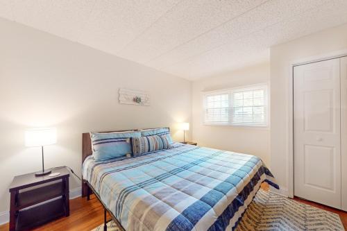 a small bedroom with a bed and a window at Midlake Memories in Lake Harmony