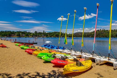 a row of kayaks lined up on a beach at Big Creek Hideaway in Groveland