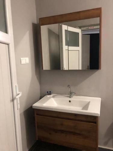 a bathroom with a white sink and a mirror at Best otel in Sandıklı