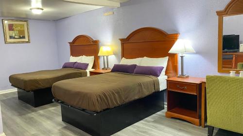 Ένα ή περισσότερα κρεβάτια σε δωμάτιο στο Budget Inn Express