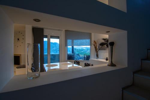 a bathroom with two sinks and a large window at Cicada 4 Bedroom Villa in Palaiokastro