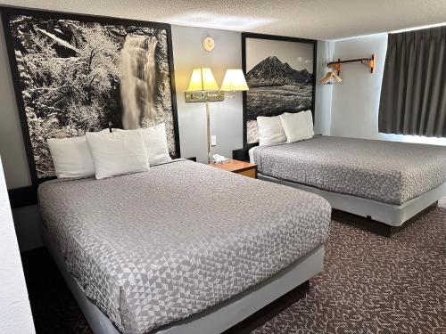 a hotel room with two beds in a room at Yankton Inn in Yankton