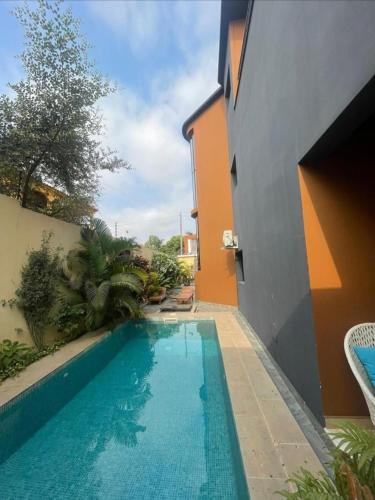 a swimming pool in the side of a house at PARAISO in Chicala