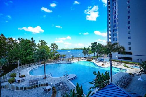 a view of a swimming pool at a resort at Apartment 5 min away from Disney 1st Floor in Orlando