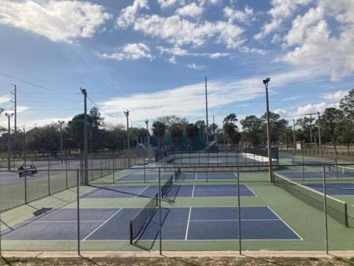 a couple of tennis courts on a court at Hidden Gem 3br/1b+Jacuzzi+busch garden+fishn+kayak in Tampa