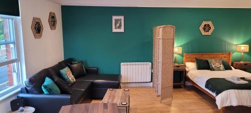 Ένα ή περισσότερα κρεβάτια σε δωμάτιο στο Leckhampton Road Apartments - Cheltenham