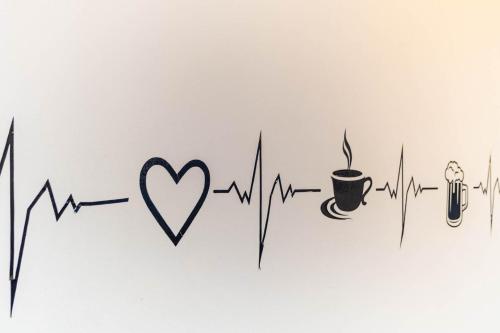 a heart attack with a cup of coffee and heartbeat at Edificio SantaMarta Medellín in Medellín