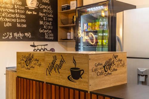 a coffee shop with a bar with writing on it at Edificio SantaMarta Medellín in Medellín