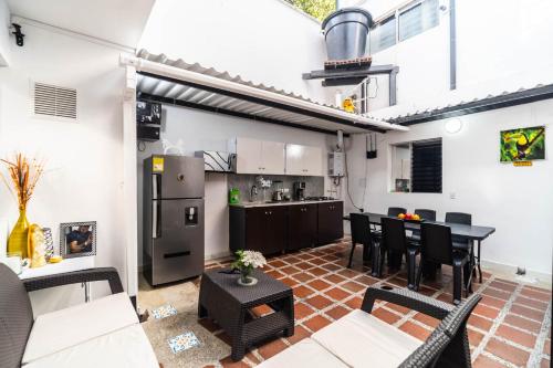 a kitchen and living room with a table and chairs at Edificio SantaMarta Medellín in Medellín