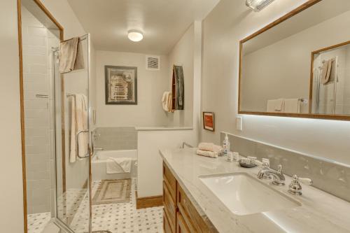 a bathroom with a sink and a shower and a mirror at Our Lake House in Zephyr Cove