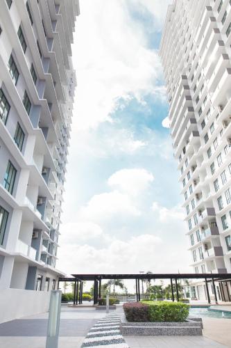 a view from between two tall buildings at Paradigm Mall 1BR-Poolview-Netflix-WiFi by JB RelaX Homestay in Johor Bahru