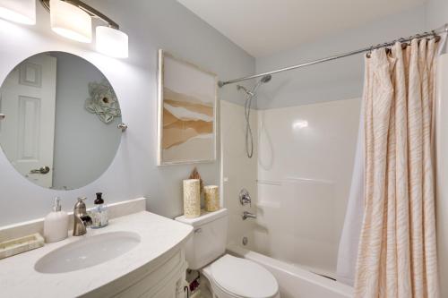 a bathroom with a sink and a toilet and a mirror at Greensboro Vacation Rental with Patio, Yard! in Greensboro