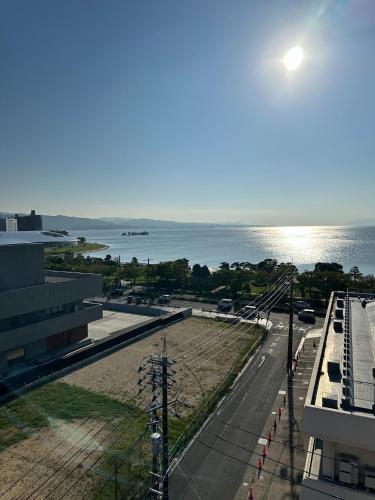 a view of a street with the ocean in the background at Shirakata Token Residence 701 - Vacation STAY 76938v in Matsue