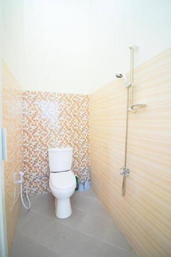a bathroom with a toilet and a shower at Villa Leora Cordoba G2 by Sans Villa in Tlekung