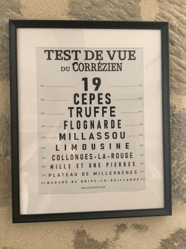 a framed picture of the test do you do differently sign at appartement de charme centre historique de Brive in Brive-la-Gaillarde